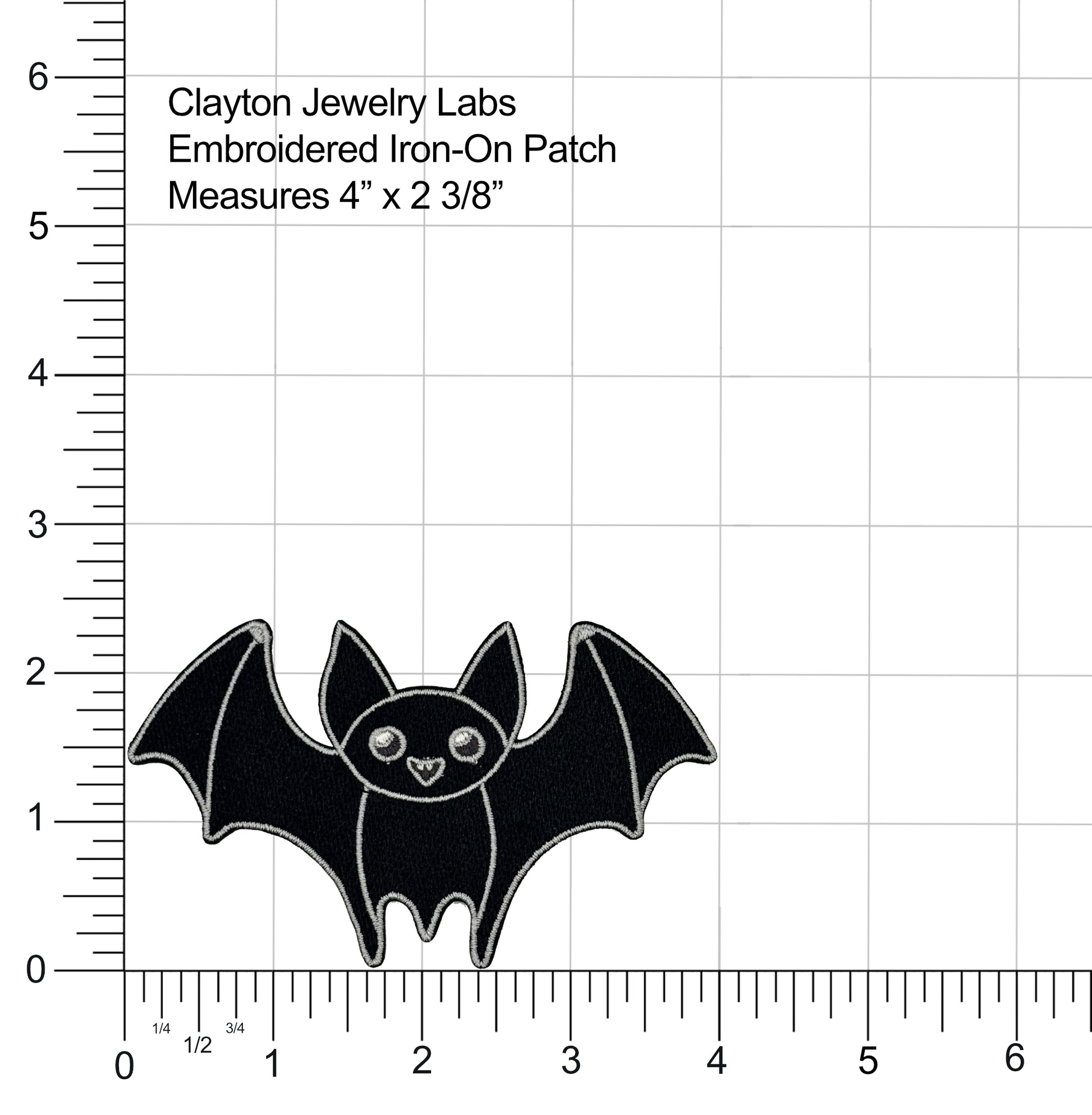 Black bat-shaped embroidered iron-on patch with measurement details on a grid background