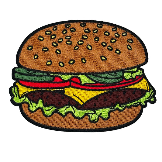Embroidered patch of a hamburger with brown bun, lettuce, tomato, and beef patty on a white background.