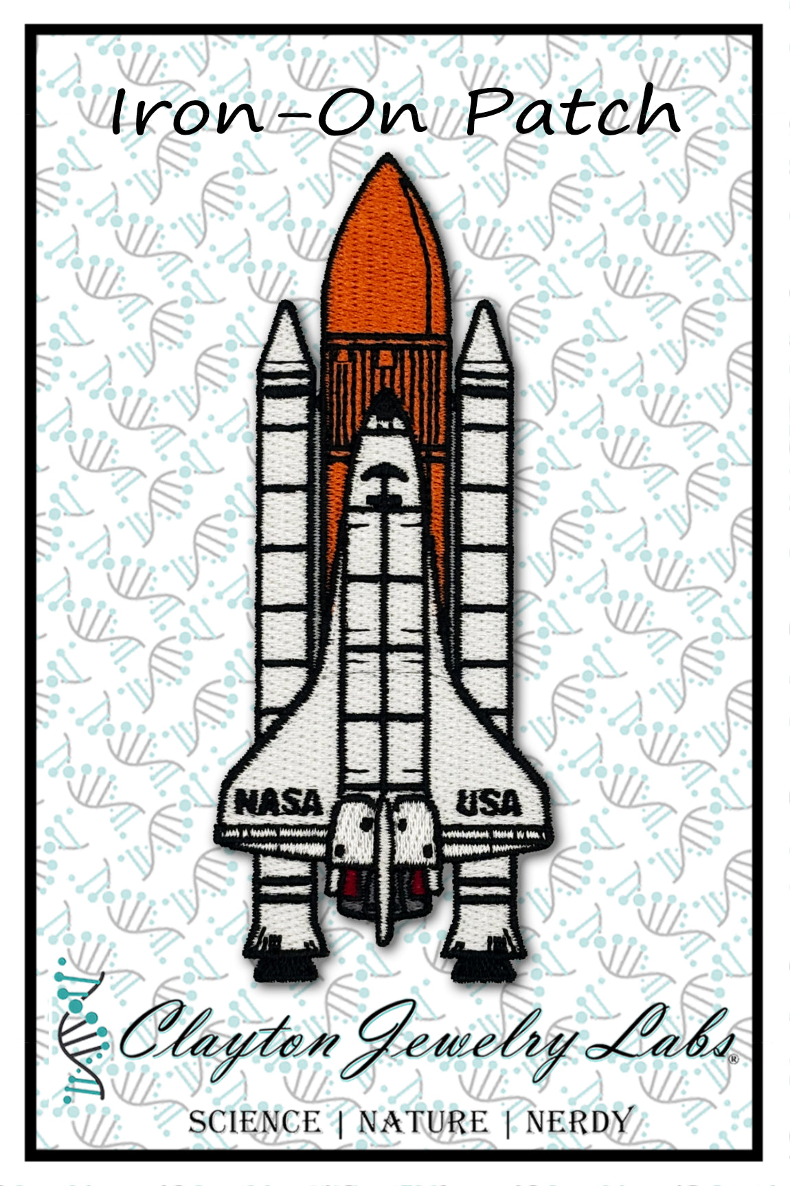 Space shuttle iron-on patch with NASA branding on a patterned background, featuring the brand 'Clayton Jewelry Labs'.
