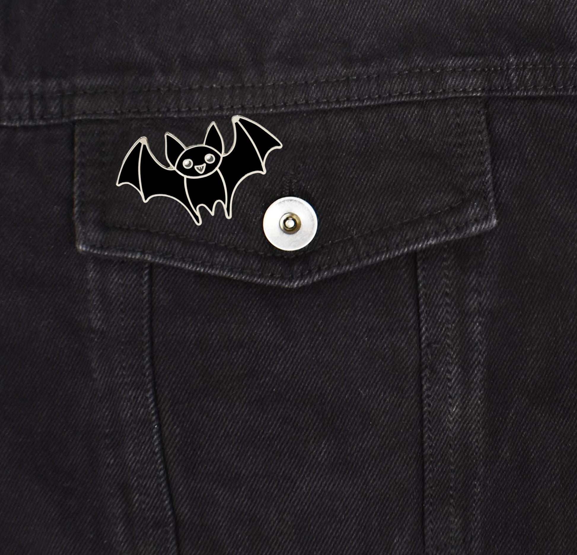 a bat sticker on the back of a pair of jeans