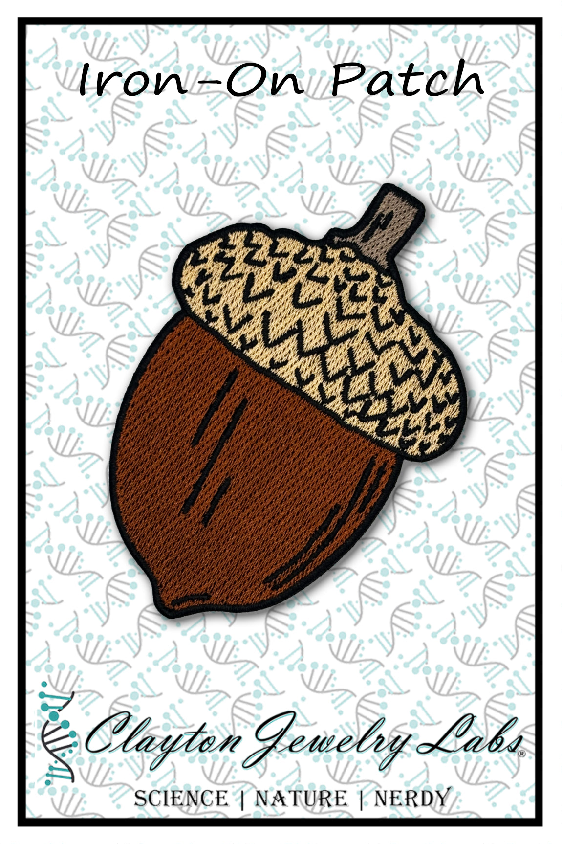 Acorn-shaped iron-on patch with Clayton Jewelry Labs branding on a light background.