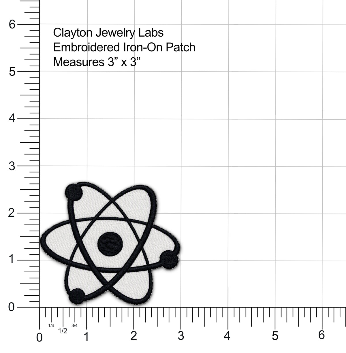 An embroidered iron-on patch featuring a black atom symbol on a light gray background, shown on a white measurement grid with ruler markings and text reading 'Clayton Jewelry Labs Embroidered Iron-On Patch Measures 3" x 3"'.