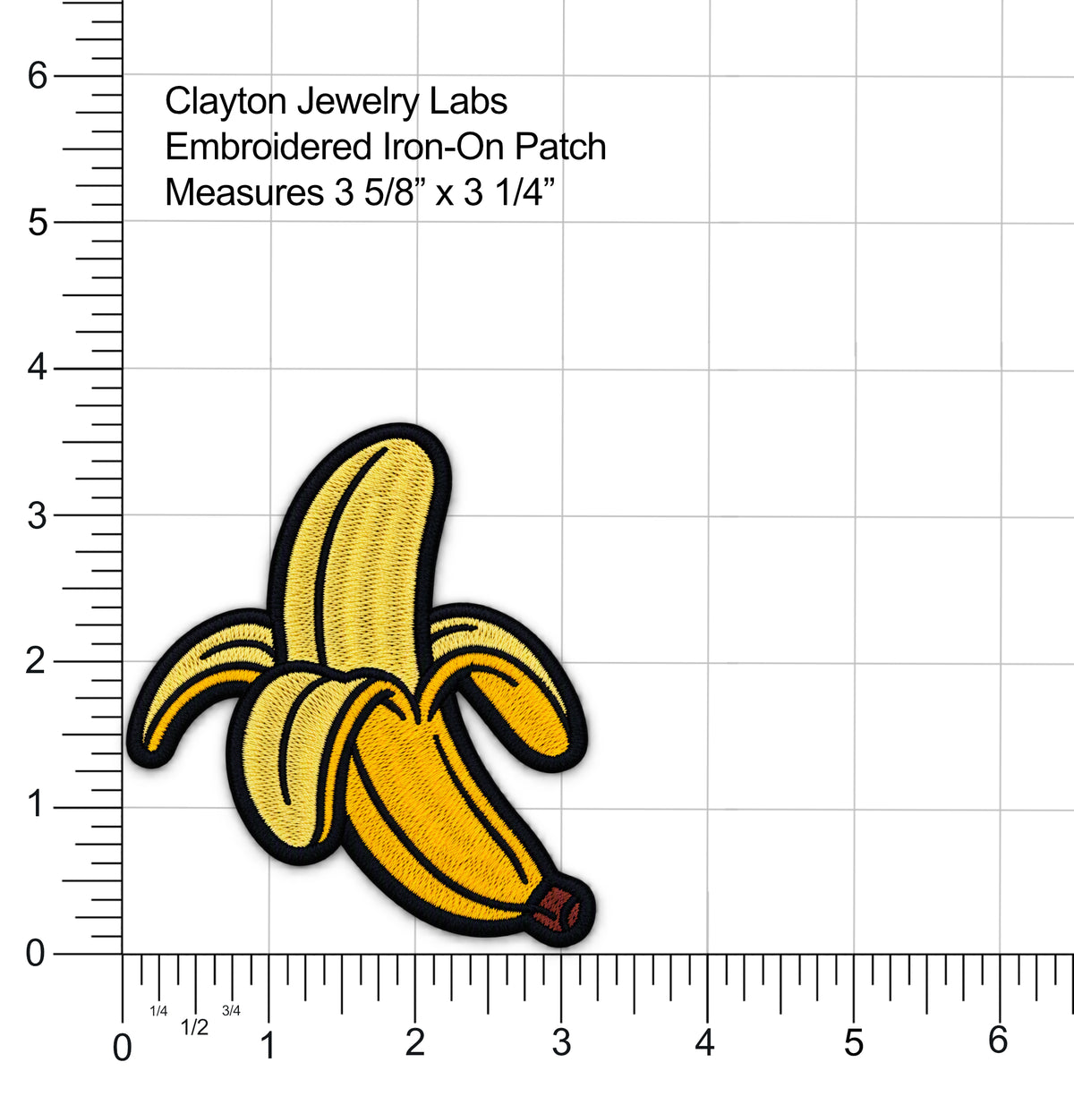 An embroidered iron-on patch shaped like a peeled banana in yellow and gold tones with black outlines, shown on a white measurement grid with ruler markings and text reading Clayton Jewelry Labs and size information.