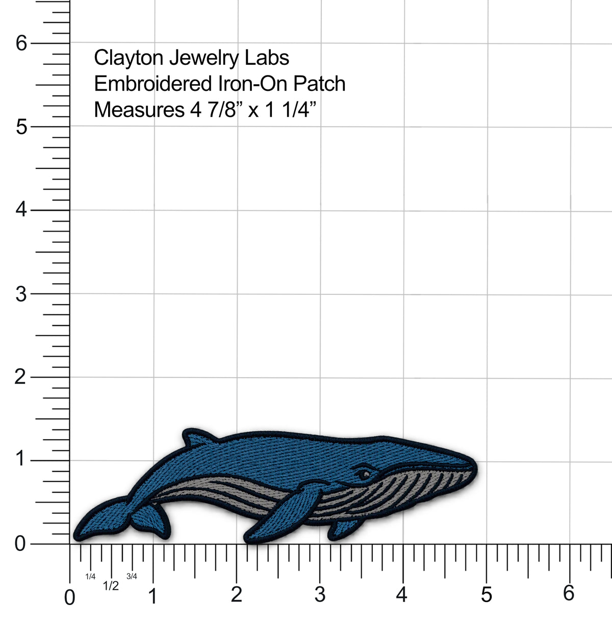 An embroidered whale-shaped iron-on patch by Clayton Jewelry Labs, shown on a white background with measurement rulers and text indicating dimensions 4 7/8" x 1 1/4".