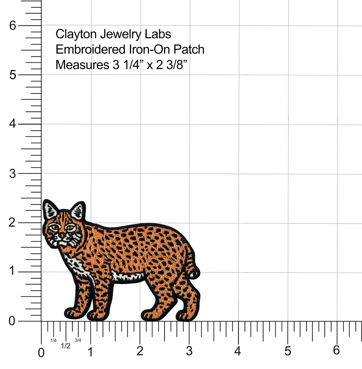 An embroidered iron-on patch of a lynx cat shown on a white background with measurement rulers and text reading 'Clayton Jewelry Labs Embroidered Iron-On Patch Measures 3 1/4" x 2 3/8"'.
