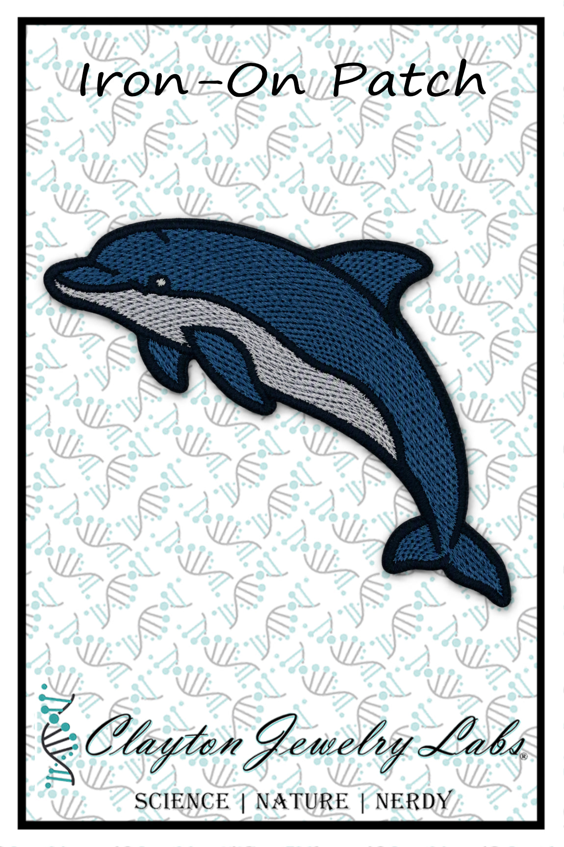 An embroidered iron-on patch featuring a blue and gray dolphin on a white background with a repeating shell pattern. The text 'Iron-On Patch' appears at the top, and 'Clayton Jewelry Labs' is printed at the bottom with the tagline 'SCIENCE | NATURE | NERDY'.