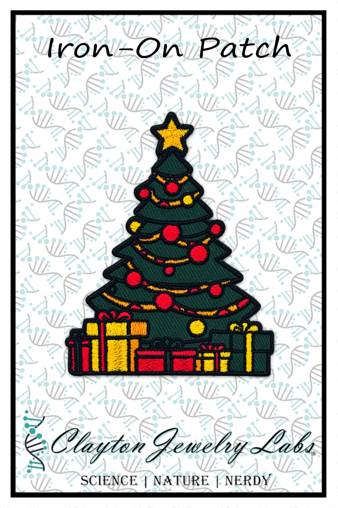An embroidered iron-on patch design of a Christmas tree with a gold star, red ornaments, yellow lights, and wrapped presents underneath, shown on a white patterned background with the text 'Iron-On Patch' and 'Clayton Jewelry Labs'.