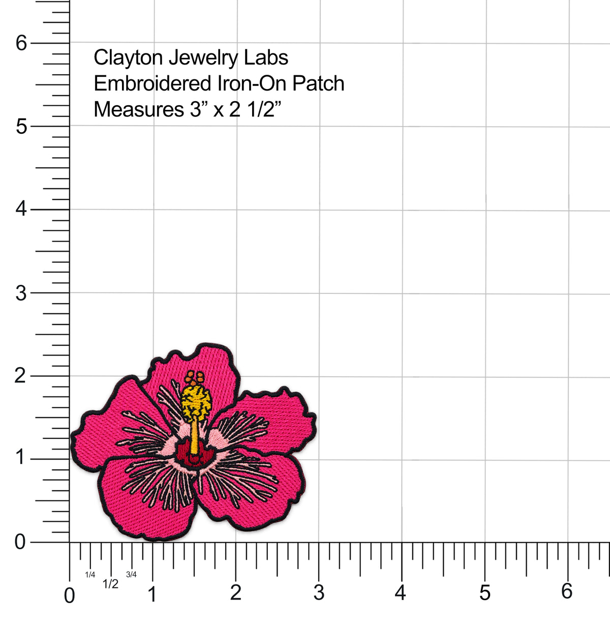 An embroidered iron-on patch of a pink hibiscus flower with a yellow center and black stitched outline, shown on a white grid background with measurement rulers and text reading 'Clayton Jewelry Labs Embroidered Iron-On Patch Measures 3" x 2 1/2"'.