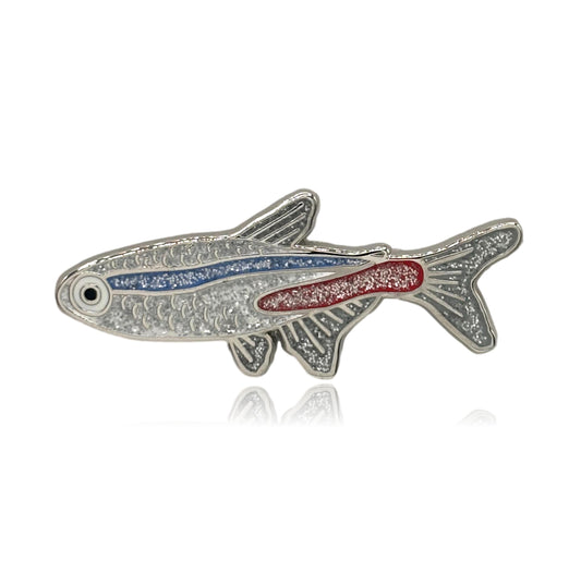 Neon Tetra Decorative fish-shaped object with red and blue details on a white background