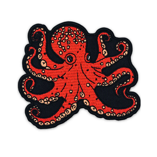 An embroidered octopus patch featuring a vibrant red octopus with beige suckers and a black stitched border, shown on a plain white background.