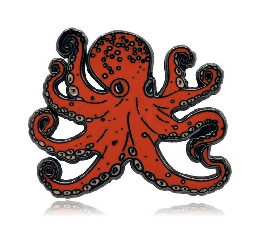 Orange octopus pin with black accents on a white background