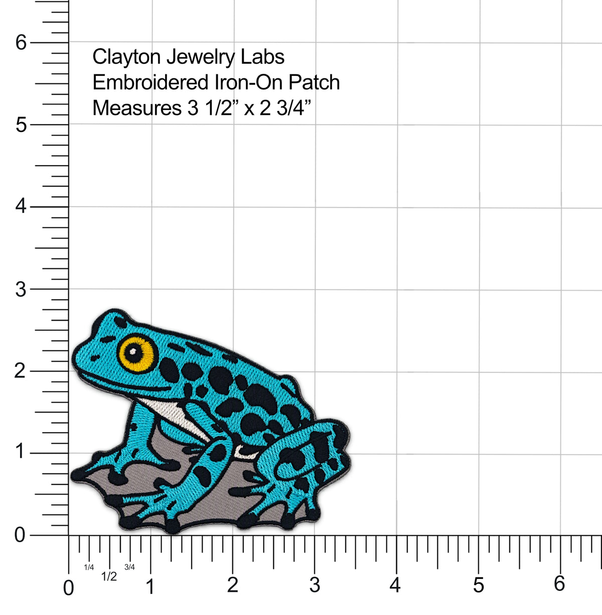 An embroidered iron-on patch of a blue and black frog sitting on a gray rock, shown on a white background with measurement rulers and text reading 'Clayton Jewelry Labs Embroidered Iron-On Patch Measures 3 1/2" x 2 3/4"'.