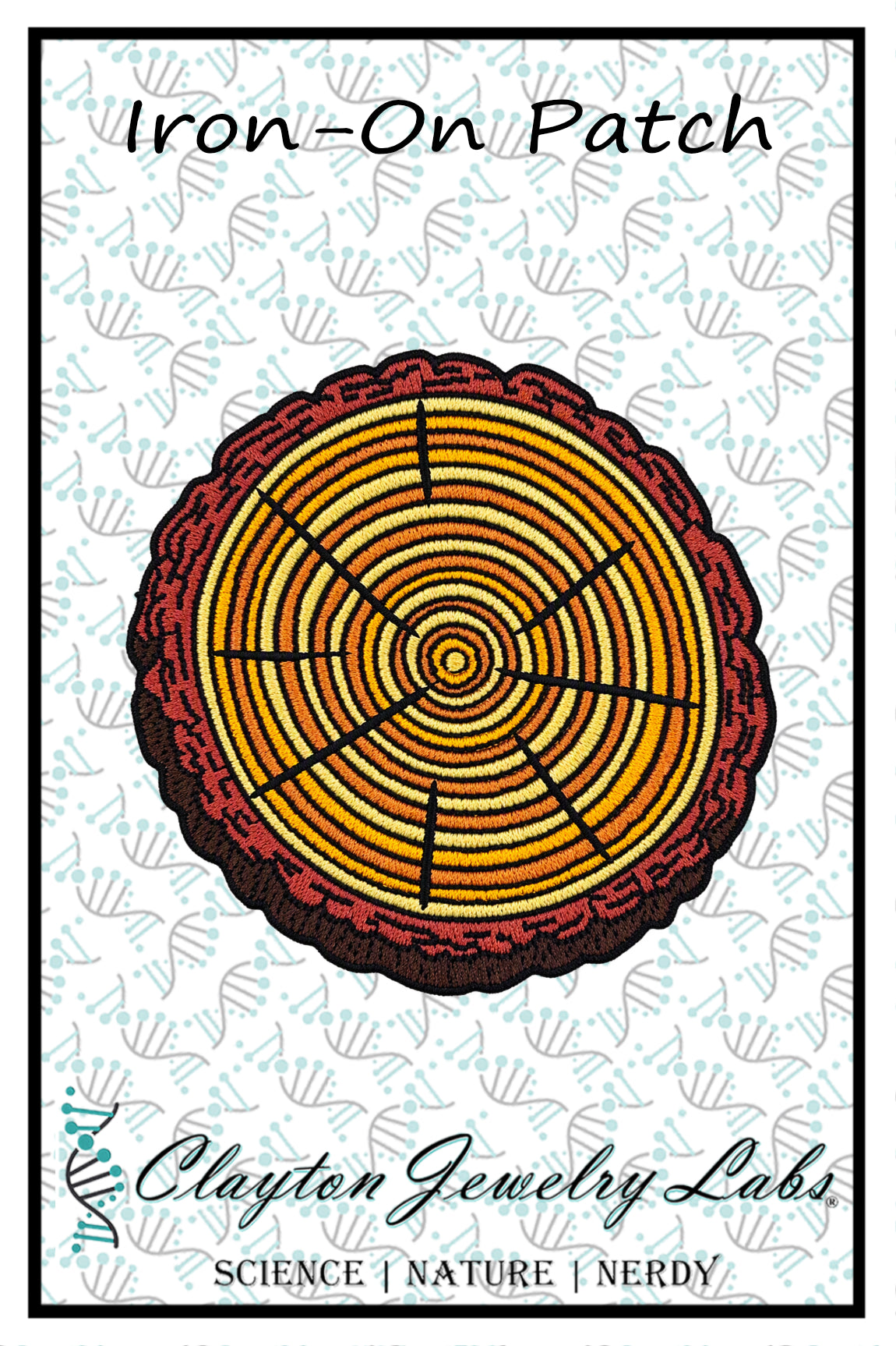 An iron-on patch featuring a circular tree-ring design in yellow, orange, and brown tones, with a dark red outer border. The patch is displayed on a white background with a light blue patterned watermark and features the text 'Iron-On Patch' at the top and 'Clayton Jewelry Labs' at the bottom.