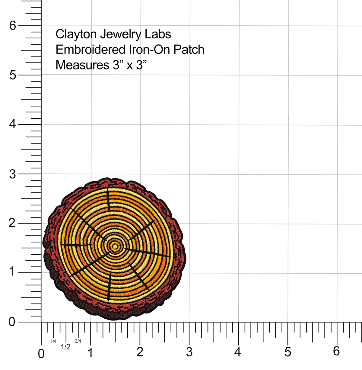 An embroidered iron-on patch shown on a white background with measurement rulers and text reading 'Clayton Jewelry Labs Embroidered Iron-On Patch Measures 3" x 3"'. The patch features concentric wood-grain style rings in yellow, orange, and red with black radial lines and a dark border.
